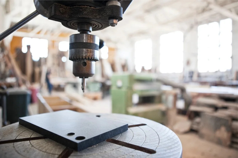 A fixed pillar drilling machine showing the drill head